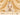 Temple jewellery necklace adorning a Jain deity idol with a detailed red stone pendant